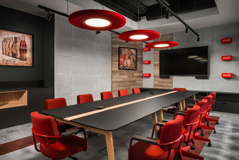 BuzziMoon Suspended in a Coca-Cola-themed meeting room
