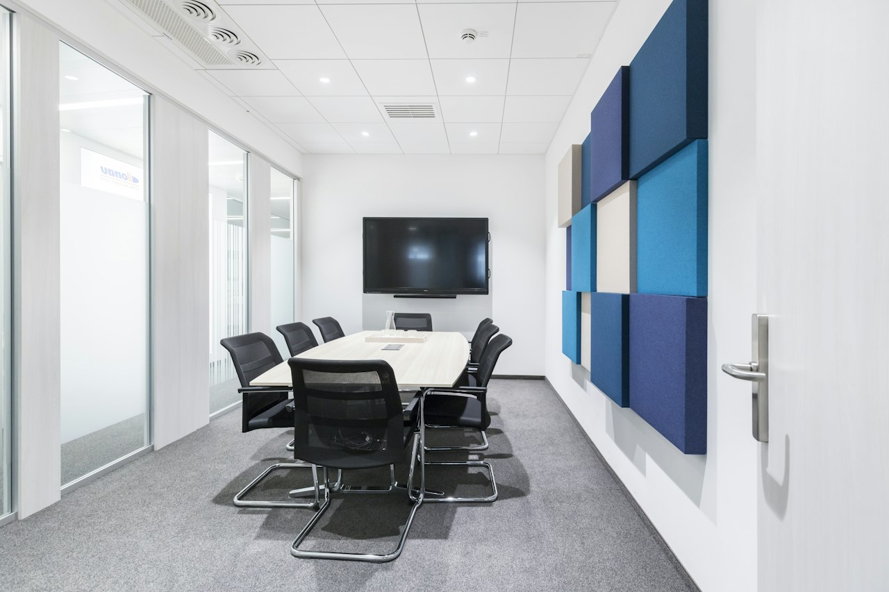 acoustic wall panel in various blue shades featured in a corporate office and meeting room